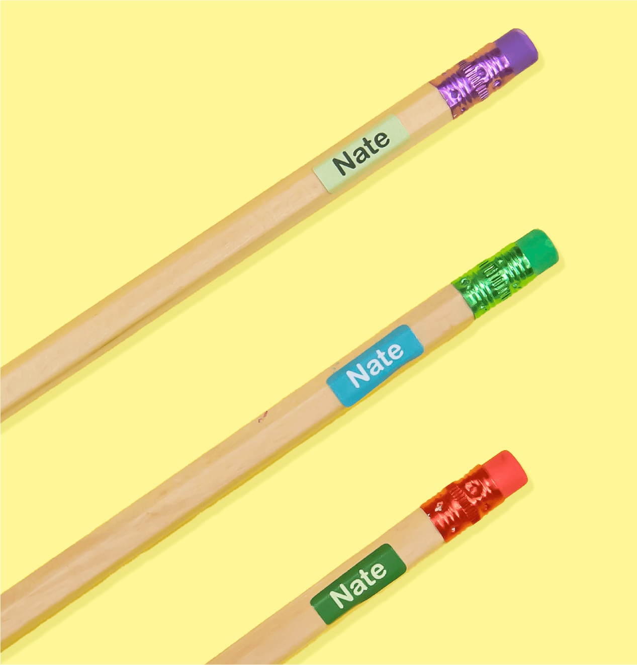 Small name labels on three pencils